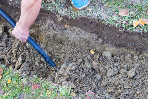 istock Man digging a ditch with a shovel in autumn 1063462232