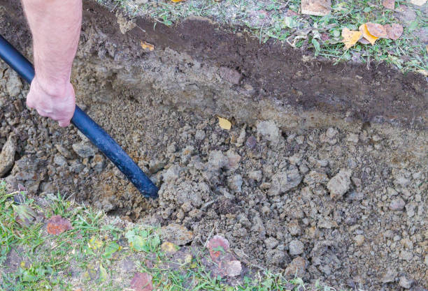istock Man digging a ditch with a shovel in autumn 1063462246