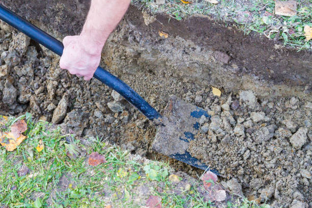 istock Man digging a ditch with a shovel in autumn 1063462248