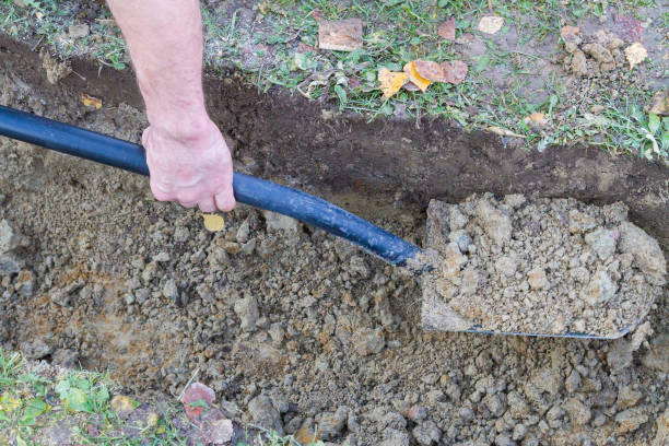 istock Man digging a ditch with a shovel in autumn 1063462314