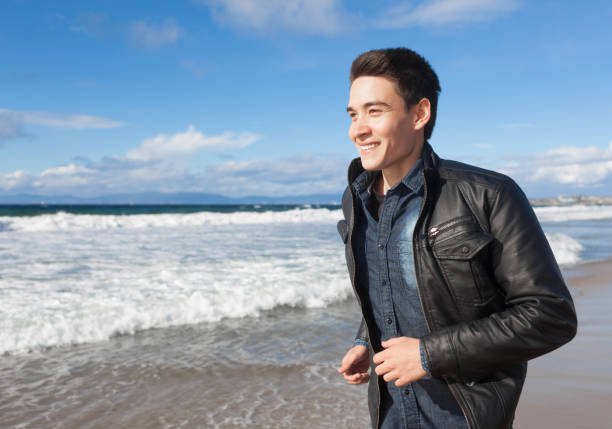 istock Happy man at the beach 1063471856