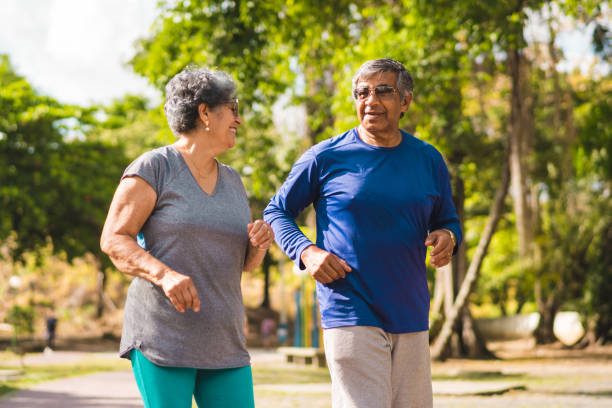 istock Senior couple running at park 1063475756