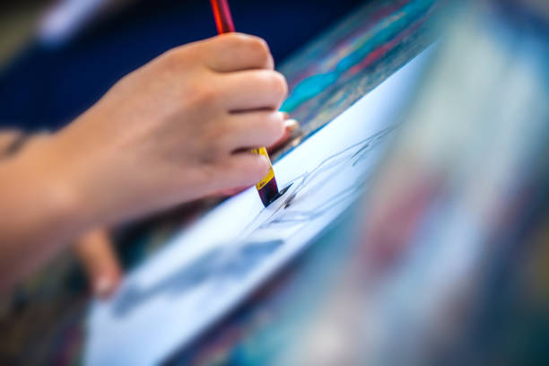 istock Students drawing and painting in class 1063479726