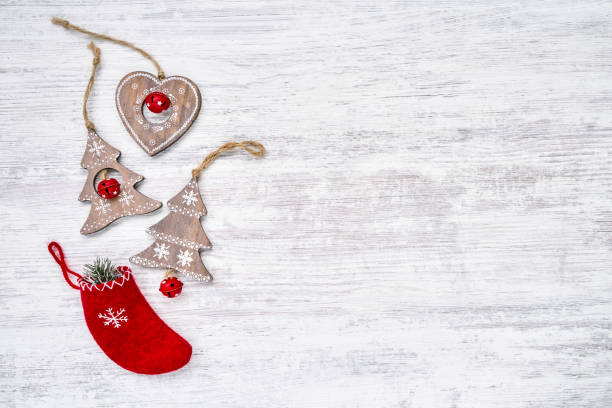 istock Christmas ornaments on white wooden background. Copy space, top view 1063492648