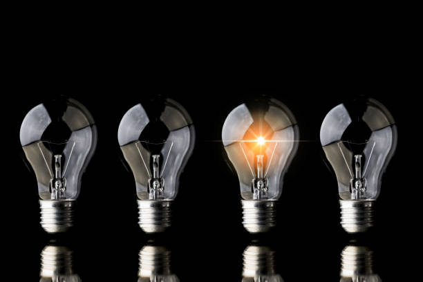 istock creativity startup business ideas concept with glow light bulb on black background 1063498202