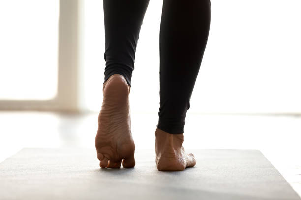 istock Sporty woman practicing yoga, doing feet strengthening exercise 1063498604
