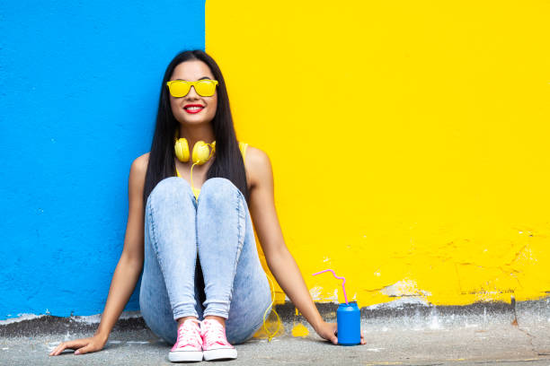 istock Young woman sitting on ground 1063498736