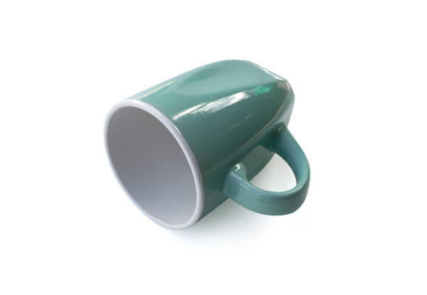 istock Green coffee cup with simple design isolated on white background 1063499312