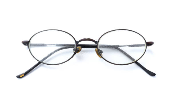 istock Old glasses with simple design isolated on white background 1063499328