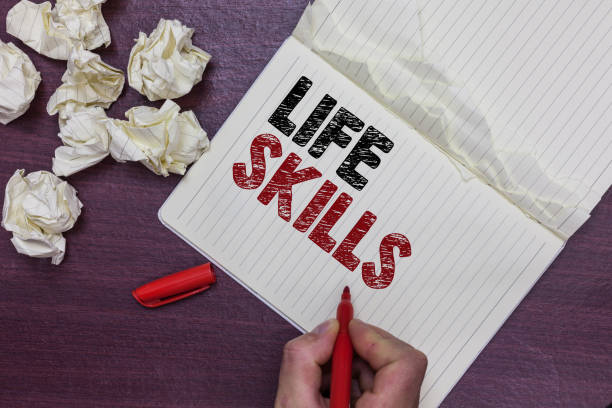 istock Handwriting text Life Skills. Concept meaning that is necessary or desirable full participation in everyday Man holding marker notebook page crumpled papers several tries mistakes. 1063499548