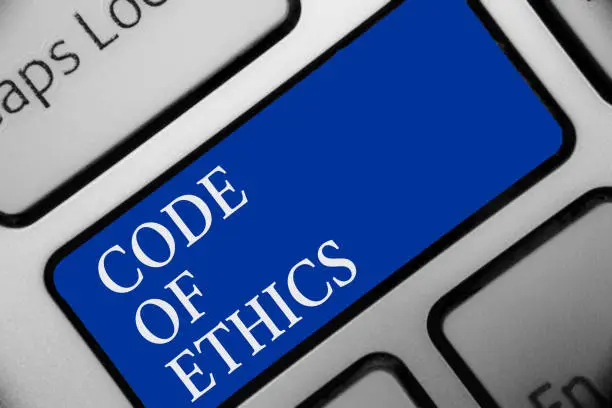 Photo of Text sign showing Code Of Ethics. Conceptual photo Moral Rules Ethical Integrity Honesty Good procedure Keyboard blue key Intention create computer computing reflection document.