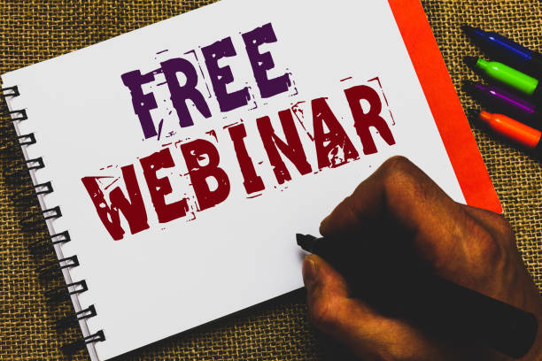 istock Word writing text Free Webinar. Business concept for Lecture Workshop Seminar that is transmitted over the Web Man hand holding marker notebook paper communicating ideas Jute background. 1063500614