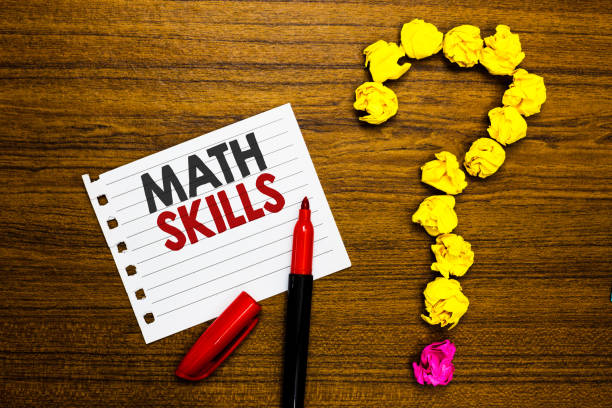 istock Handwriting text Math Skills. Concept meaning starting to learn how to count numbers add divide use equation Paper marker crumpled papers forming question mark wooden background. 1063500706
