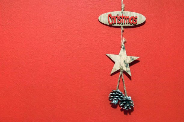 istock Christmas with hanging decorations on red background. Christmas red background with christmas decoration. 1063502932