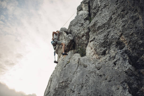 istock Disability guy free climbing in nature 1063512482