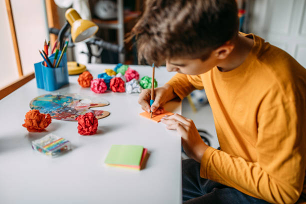 istock Teenage boy doing homework 1063516206