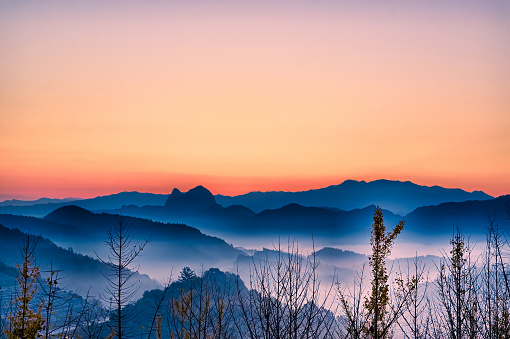 Picturesque view of mountains covered with forest under sky