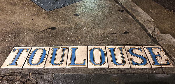 Toulouse street sidewalk tiles in the French quarter.