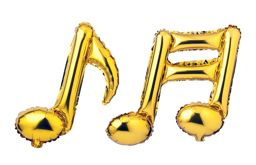 Musical note of golden foil balloons isolated on a white background