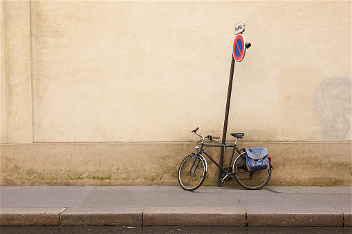 A bike against a wall in the city of Paris,France.