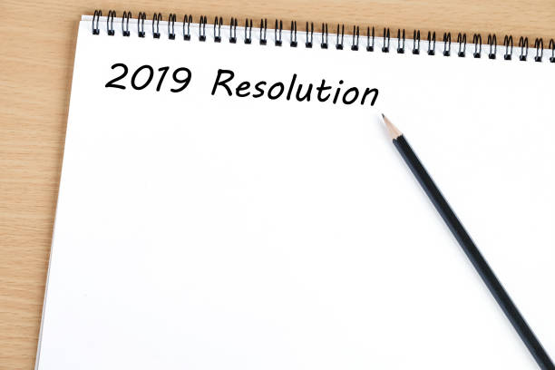 istock 2019 resolution on blank paper notebook background, with copy space for text, business background concept 1063555634
