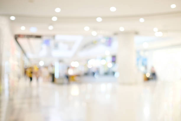 istock Blurred background, Blur store with people and bokeh light, business background 1063555758