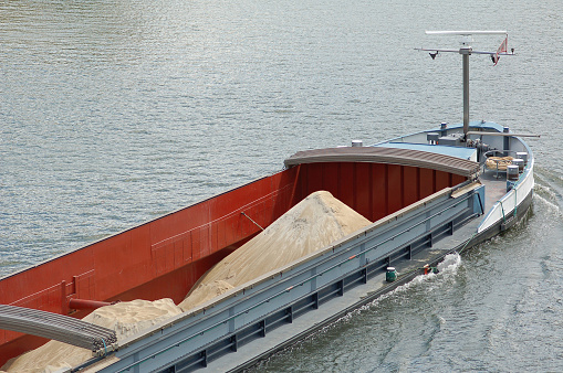 Barge with construction material on mosel river
