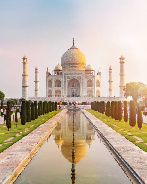 istock Sun rise at Taj Mahal front view reflected on the reflection pool. 1063572656