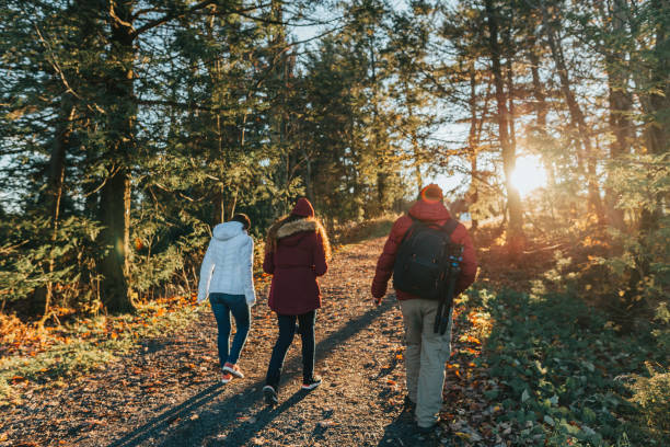 istock Friends walking on the trail at sunset 1063577432