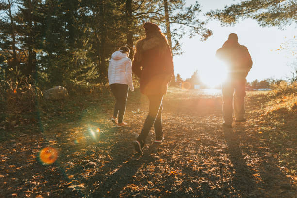 istock Friends walking on the trail at sunset 1063577570