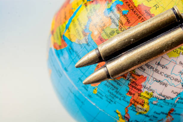 istock Bullet on globe as Conceptual against the war 1063579194