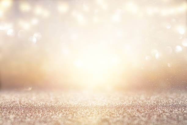 istock glitter vintage lights background. silver and gold. de-focused. 1063583158