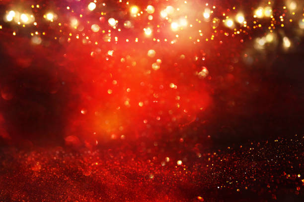 istock Red, black and gold glitter lights background. defocused. 1063583202