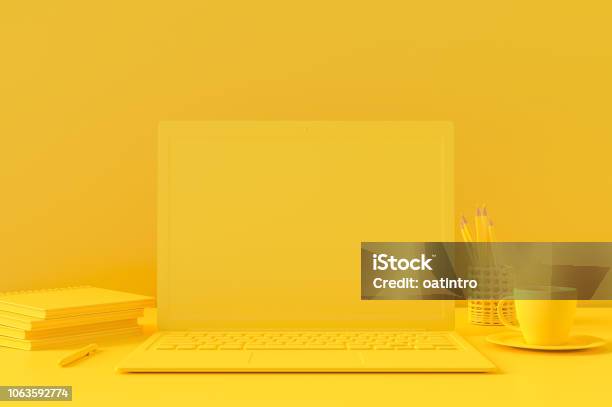 Minimal Concept Laptop On Table Work Desk Yellow Color Stock Photo - Download Image Now