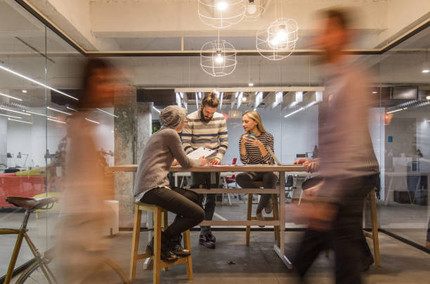 istock Casual meeting at busy corporate office! 1063592908
