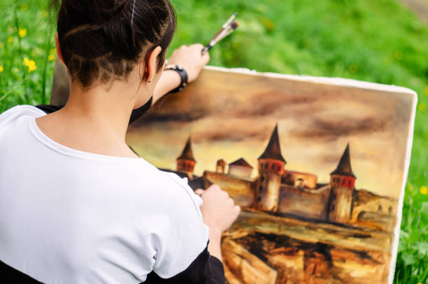 istock A young artist student paints a picture. 1063598636