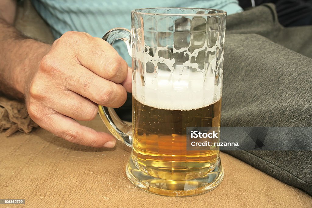 Beer in hand  Adult Stock Photo