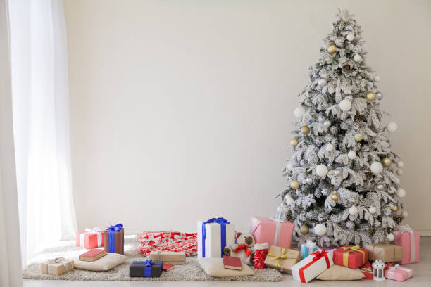 istock winter Christmas new year tree gifts home decor 1063615254
