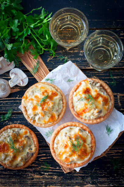 istock Tartlets with mushrooms, chicken and cheese, top view, selective focus 1063615658