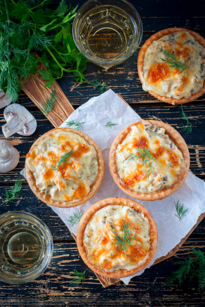 istock Tartlets with mushrooms, chicken and cheese, top view, selective focus 1063615680