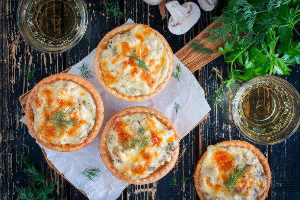 istock Tartlets with mushrooms, chicken and cheese, top view, selective focus 1063615702