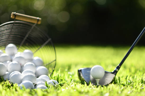 istock Golf ball on green grass ready to be struck for practice 1063615978