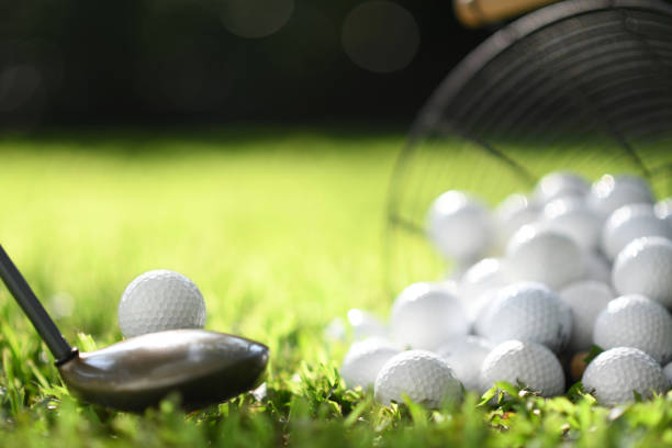 istock Golf ball on green grass ready to be struck for practice 1063615988