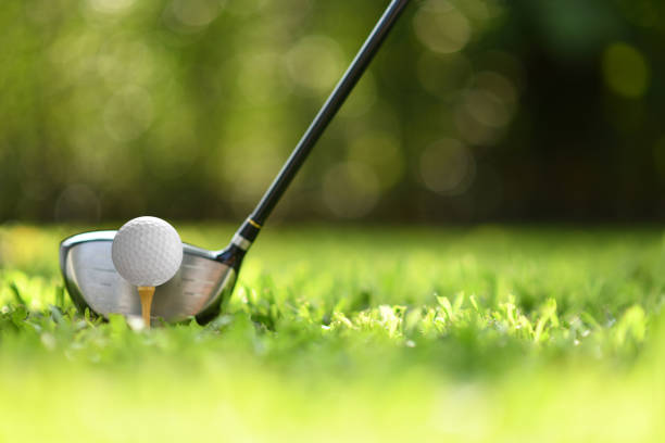 istock Golf ball on green grass ready to be struck on golf course background 1063616278