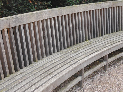 Very long curved outside wooden seat / bench
