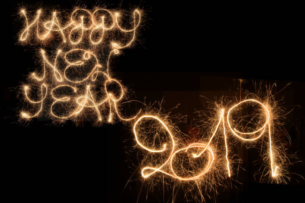 Happy New Year 2019 - written with sparklers Happy New Year 2019 - written with sparklers hogmanay photos stock pictures, royalty-free photos & images