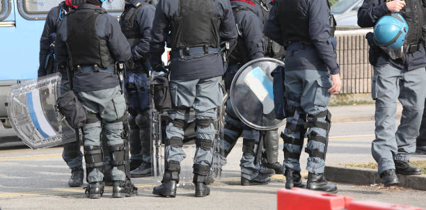 istock police team in riot gear before the sport to avoid scuffles 1063629016