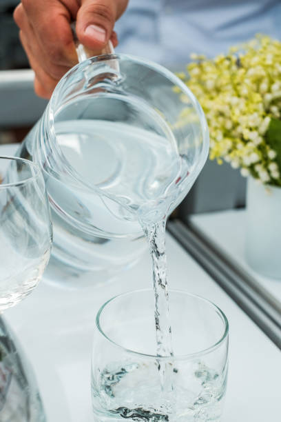 istock Pouring drinking water in glass 1063629200