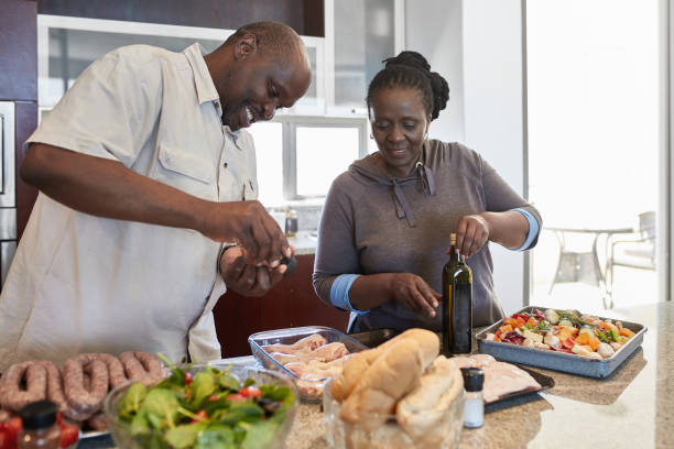 istock Senior couple preparing food at home 1063629302