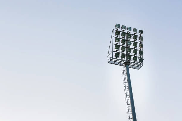 istock large tall high outdoor stadium spotlights on rigid frame construction under natural sunlight. spotlights tower in the stadium 1063630684